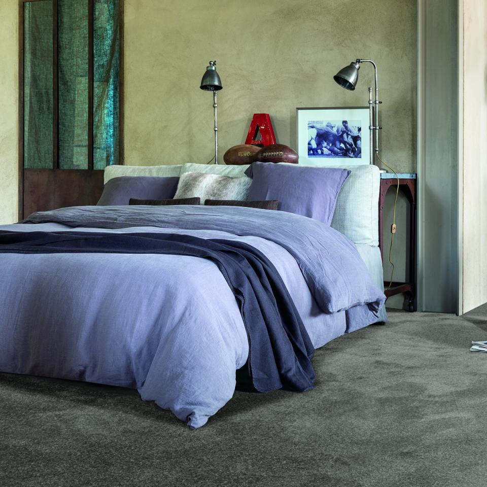 Ambiant tapijt met bed in slaapkamer